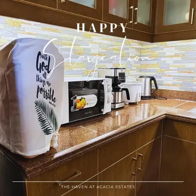 a kitchen counter with a sign that says wish us a happy at The Haven at Acacia Estates in Manila