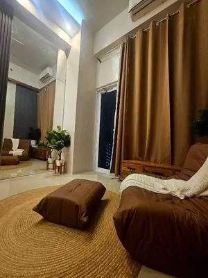 a bedroom with a large bed and a large window at Uno - Condo Unit in SM Jazz Residences in Manila