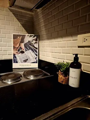 a bottle of wine sitting on top of a kitchen counter at Uno - Condo Unit in SM Jazz Residences in Manila