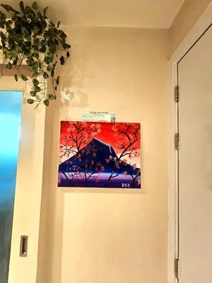 a painting of a tree on a wall at Uno - Condo Unit in SM Jazz Residences in Manila