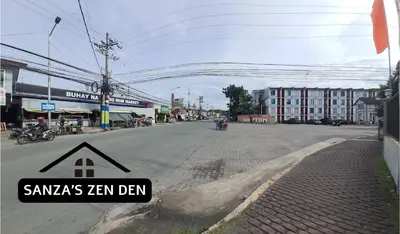 a street with a sign on the side of the road at Modern 2BR Condo with Terrace,Netflix,Pool,& WiFi in Imus