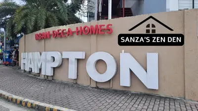 a sign on a wall with a sign for a home depot at Modern 2BR Condo with Terrace,Netflix,Pool,& WiFi in Imus