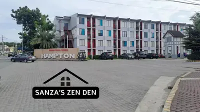 a sign on a street in front of a building at Modern 2BR Condo with Terrace,Netflix,Pool,& WiFi in Imus