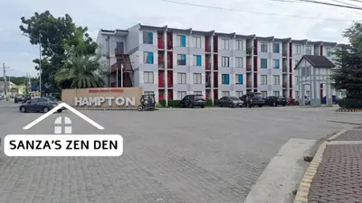 a sign on a street in front of a building at Modern 2BR Condo with Terrace,Netflix,Pool,& WiFi in Imus