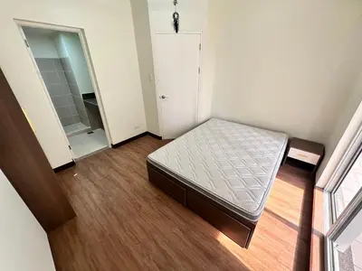 a small bedroom with a bed and a closet at blue sky viewing in Manila
