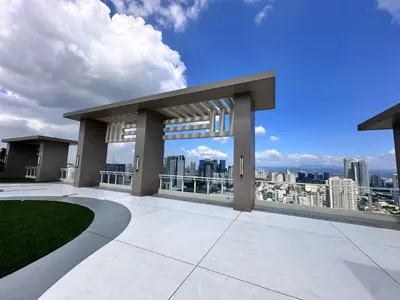 a view of the city from the roof of a building at blue sky viewing in Manila