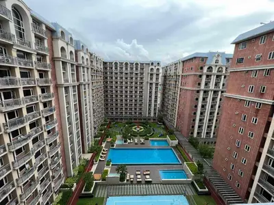an aerial view of a courtyard with two large buildings at Cozy 1-BR Retreat Near MOA Pool view in Manila