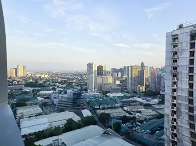 a view of a city with tall buildings at 1BR Condotel with Balcony at FAME Residences #FM56 in Manila