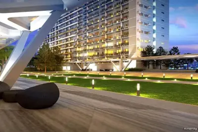 a skateboard laying on the ground in front of a building at 1BR Condotel with Balcony at FAME Residences #FM56 in Manila