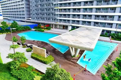 an overhead view of a swimming pool in a building at 1BR Condotel with Balcony at FAME Residences #FM57 in Manila