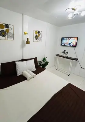 a living room with a couch and a table at ACL Staycation Home in Imus & Kawit with portable pool unit 2 in Kawit