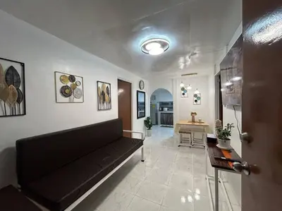 a living room with a couch and a table at ACL Staycation Home in Imus & Kawit with portable pool unit 2 in Kawit