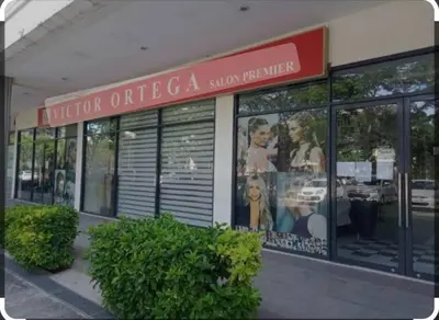 a store with a sign on the side of a building at Cozy 3 Bedroom Staycation near BGC Makati Airport in Manila