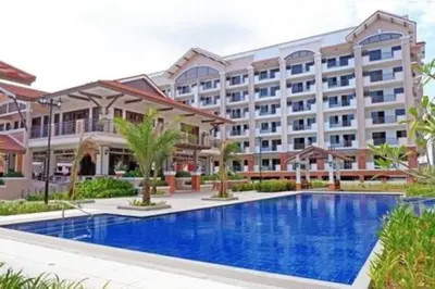 an image of a hotel with a swimming pool at Cozy 3 Bedroom Staycation near BGC Makati Airport in Manila