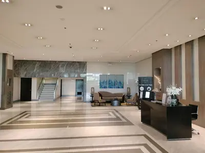 a lobby of a hotel with a reception desk at The Nest C5-7F EightyOne Newport Boulevard Condominium, Pasay City in Manila