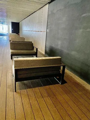 a row of empty benches in a room at Ikigai's Alpha Makati City View Condo with Balcony Perfect for Relaxation in Manila