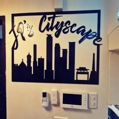 a sign on a wall with a city on it at JP's Cityscape in Manila