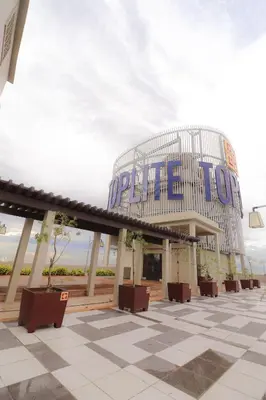 a building with a sign on top of it at JP's Cityscape in Manila