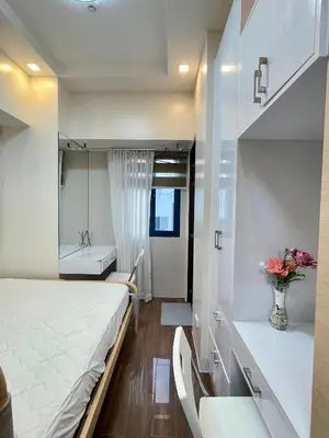 a small room with a bed and a bathroom at Beauty Cindrella Home Makati Penthouse 3 Bedroom in Manila