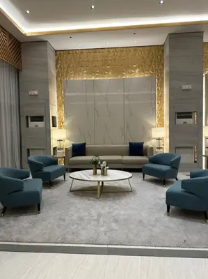 a lobby with couches and a table and chairs at Vince Cozy Staycation in Manila