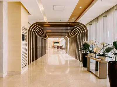a hallway in a building with aavy hallway at Oranje Suite Near Naia Terminal in Manila