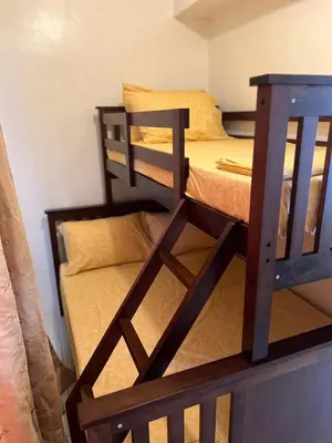 a pair of bunk beds in a room at Laureano Di Trevi Tower in Manila