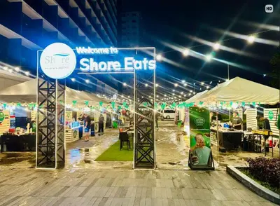 a sign for a show exhibits at a convention at Urban Luxe Stay at Shore 3 in Manila