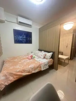 a bedroom with a bed in a room at Nalin house SHORE 2 Residences in Manila