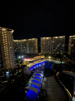 a view of a resort at night with a pool at La Primera Deluxe in Manila