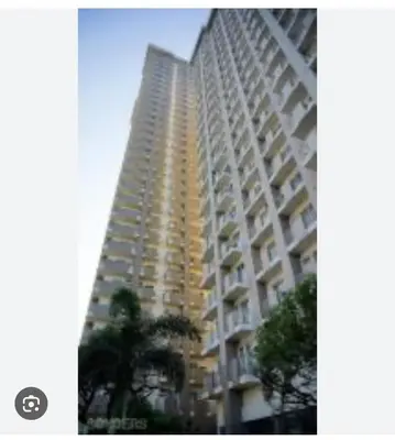 a tall apartment building with a yellow at 2301 Jazz View Condo in Manila