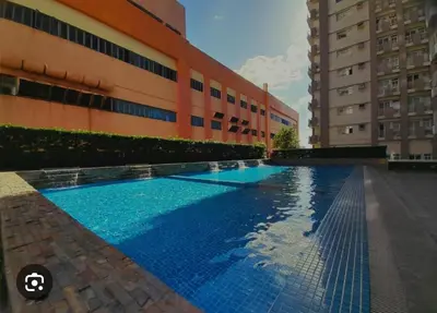 a large swimming pool in front of a building at 2301 Jazz View Condo in Manila