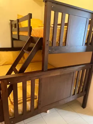 a wooden bunk bed in a room at 2301 Jazz View Condo in Manila