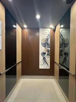 a hallway with two paintings on the wall at Casa Antonietta at Shores Residences in Manila
