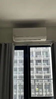 a window with a view of a building at Casa Antonietta at Shores Residences in Manila