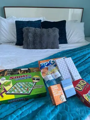 a bed with some food and snacks on it at Alphas Haven in Manila