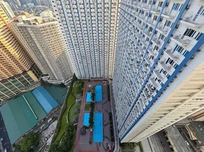 an aerial view of a city with tall buildings at 1BR Condotel with Balcony at SM Light Residences #LT08 in Manila