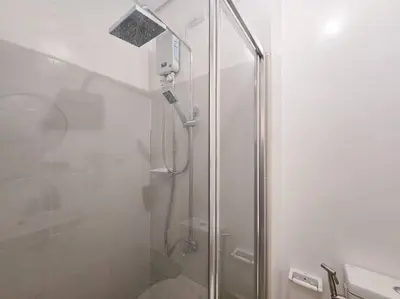 a shower with a glass door in a bathroom at 1BR Condotel with Balcony at SM Light Residences #LT09 in Manila