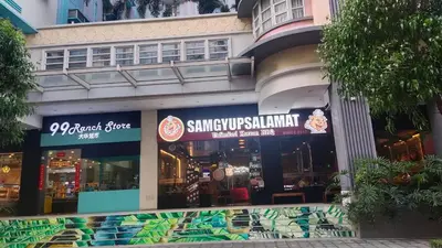a restaurant with a sign on the side of a building at 1 Bedroom unit near NAIA T3 in Manila