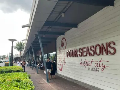 a group of people standing outside of a store at Shore Family Suite 2 Beds WiFi TV Netflix Near MOA 9120 in Manila