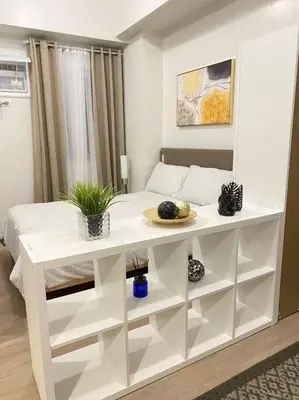a white table in a room with a bed at SMDC Park Residences near SM City Sta Rosa unit 1 in Ibaba
