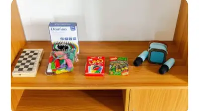 a shelf with toys and snacks on it at Sosyal Staycation , Pasay City Shore Residences Tower D Sunrise Drive Mall of Asia Complex Pasay City Philippines SMDC SHORE 1 RESIDENCES Pasay City in Manila