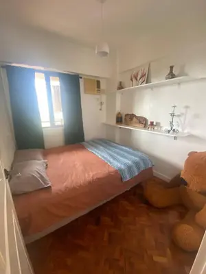 a bedroom with a bed and a teddy bear at Raya Garden Vacation Home 2 bedroom sunset view in Manila