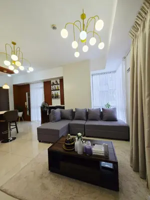 a living room with a couch and a table at Cozy 2BR 2BA 2 Balconies Manhattan Heights Cubao in Manila