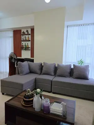 a living room with a couch and a coffee table at Cozy 2BR 2BA 2 Balconies Manhattan Heights Cubao in Manila