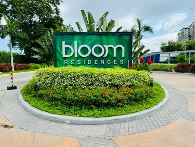 a sign for a bloom technologies sign in a park at SMDC Bloom residence Sucat Stunning 2BR in Manila