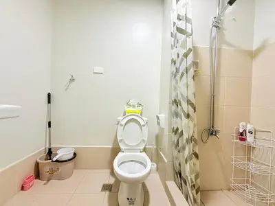 a bathroom with a toilet and a shower at SMDC Bloom residence Sucat Stunning 2BR in Manila