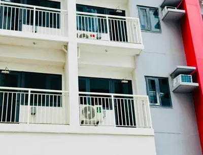a white building with white balconies and windows at SMDC Bloom residence Sucat Stunning 2BR in Manila