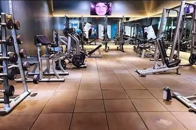 a gym with a lot of tread machines at South Residences, Las Piñas in Manila