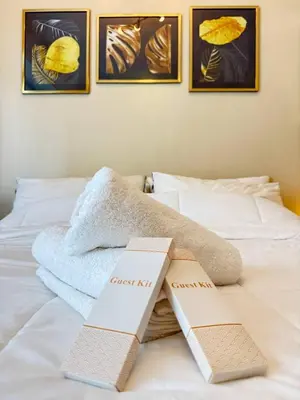 two boxes sitting on top of a bed at Condotel near NAIA T3 Airport in Manila