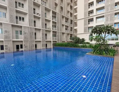 an empty swimming pool in front of a building at The Room of Requirement in Manila